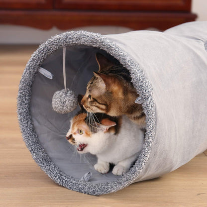 "🎉 Unleash the Fun! 🐾 Check out our Collapsible Cat Tunnel - the ultimate playtime hideaway for your furry friend! 🐱✨ Durable suede, crinkle sounds, and a fun ball included! 🐾💖 #CatLovers #PetPlaytime"